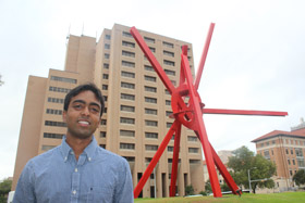  Sai Gourisankar, Plan II Honors and Chemical Engineering junior, stands next to di Suvero's Clock Knot sculpture outside the UT Austin Chemical and Petroleum Engineering building, in which he attends classes.